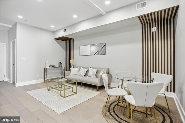 living room with light hardwood / wood-style flooring