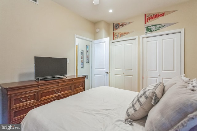 bedroom featuring multiple closets