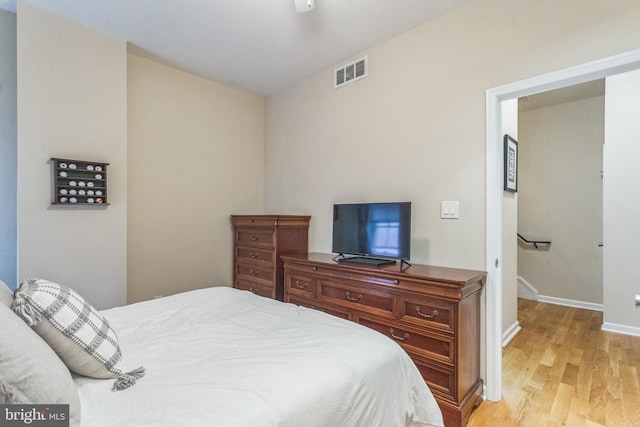 bedroom with light wood-type flooring