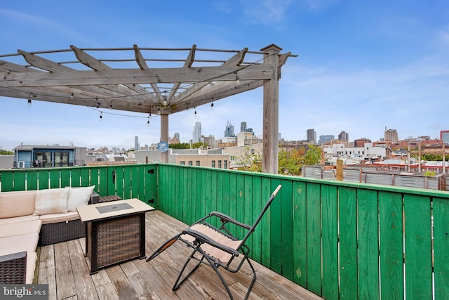 deck featuring outdoor lounge area and a pergola