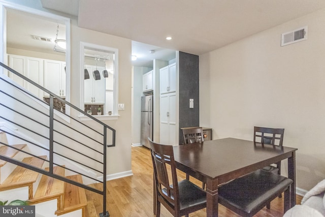 dining space featuring light hardwood / wood-style flooring