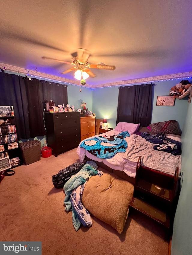 bedroom featuring ceiling fan and carpet floors