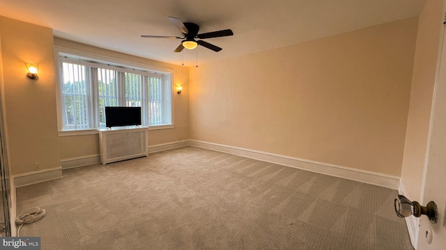 empty room with carpet flooring and ceiling fan