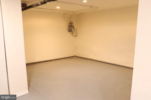 unfurnished room featuring concrete flooring