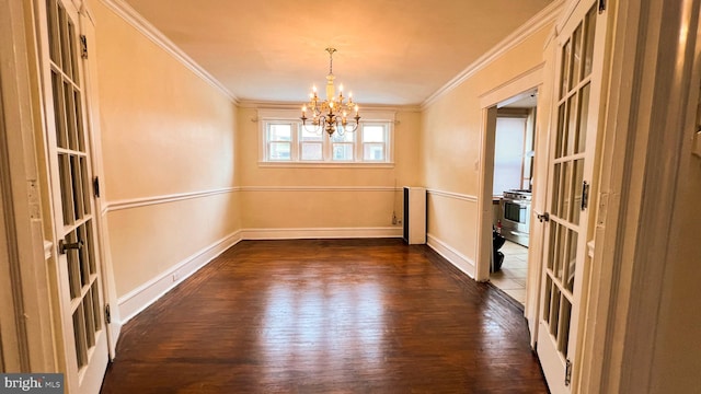 unfurnished dining area with a notable chandelier, crown molding, french doors, and dark hardwood / wood-style flooring