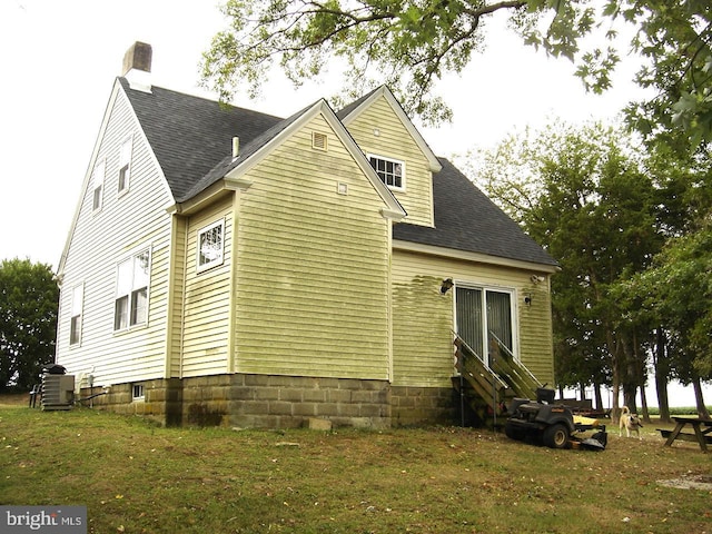 back of property with central AC unit