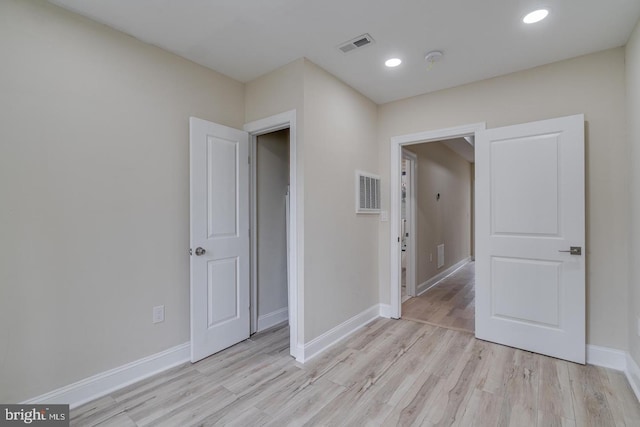 unfurnished bedroom featuring light hardwood / wood-style flooring