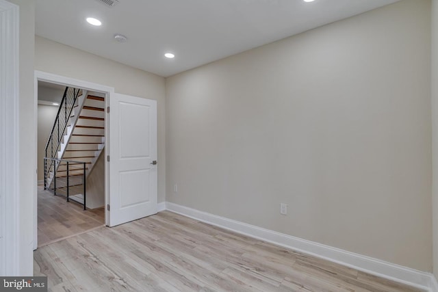 unfurnished room with light hardwood / wood-style floors