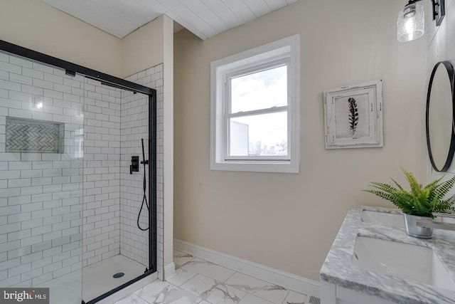 bathroom featuring vanity and a shower with shower door