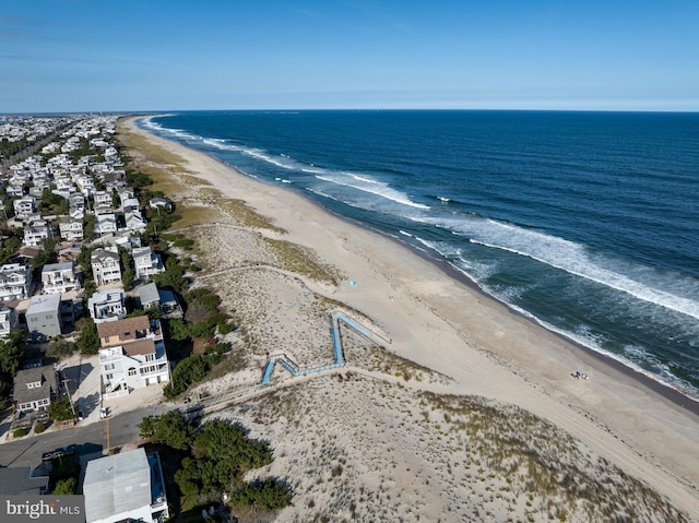 aerial view featuring a water view and a view of the beach