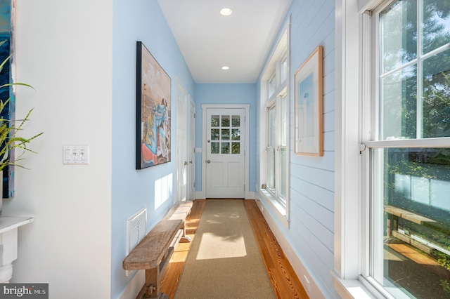 doorway featuring hardwood / wood-style flooring and plenty of natural light