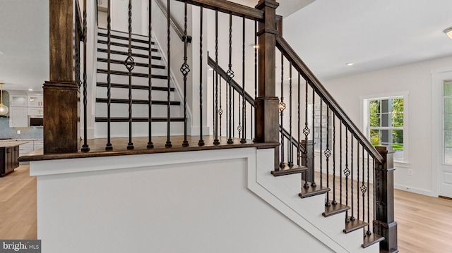 stairway featuring hardwood / wood-style floors