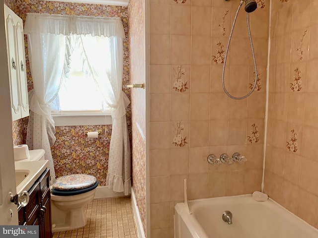 full bathroom featuring vanity, tile patterned flooring, toilet, and tiled shower / bath