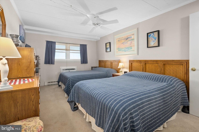 carpeted bedroom featuring crown molding, a baseboard radiator, and ceiling fan