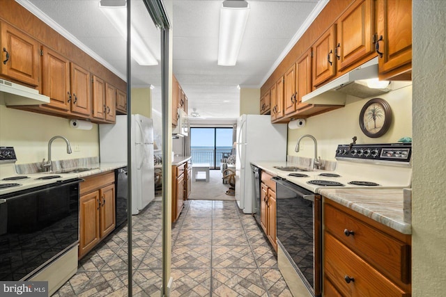 kitchen featuring a textured ceiling, ornamental molding, sink, and white appliances