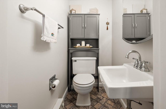 bathroom with sink and toilet