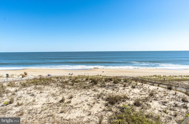 property view of water featuring a beach view