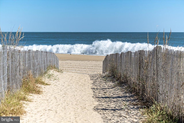 property view of water featuring a view of the beach