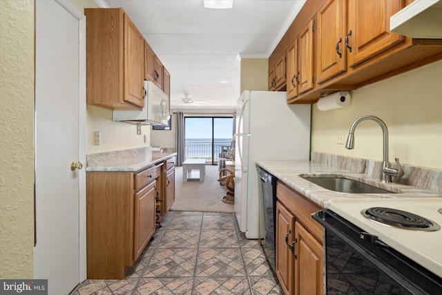 kitchen featuring white appliances, crown molding, sink, and exhaust hood