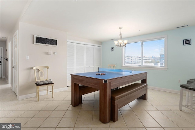 playroom featuring light tile patterned floors and a chandelier