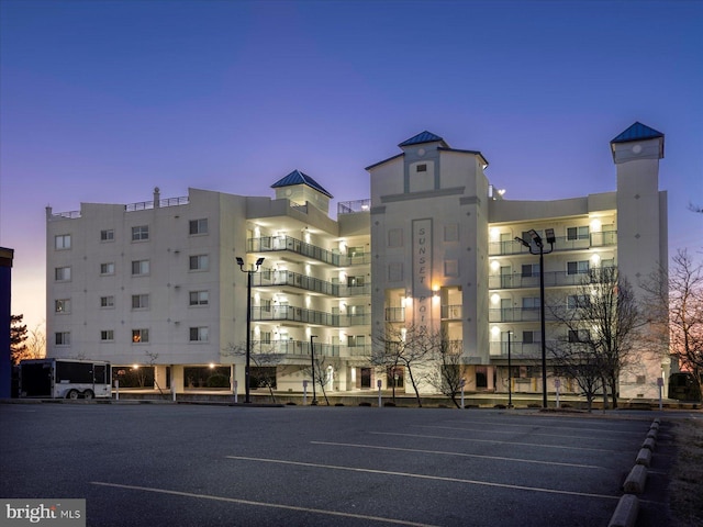 view of outdoor building at dusk