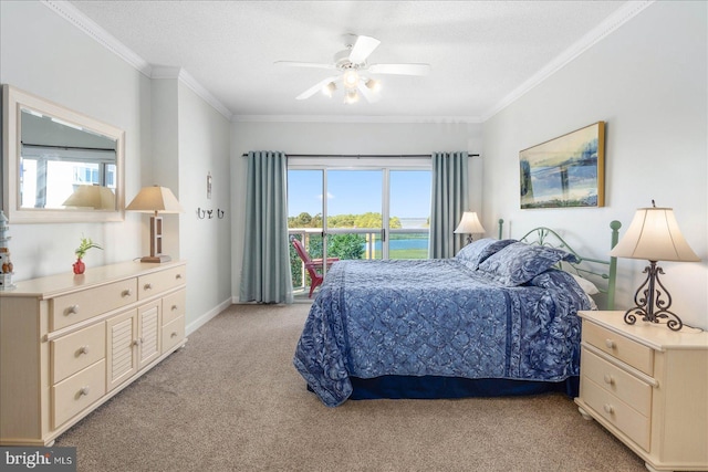 carpeted bedroom featuring ceiling fan, a textured ceiling, and crown molding