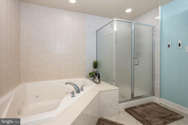 bathroom featuring tile patterned flooring and separate shower and tub