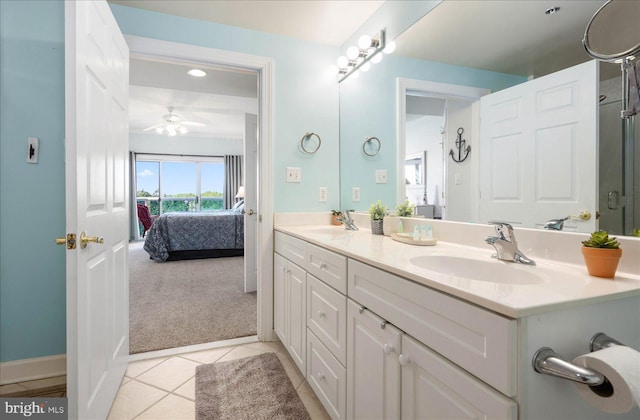 bathroom with tile patterned floors, ceiling fan, and vanity