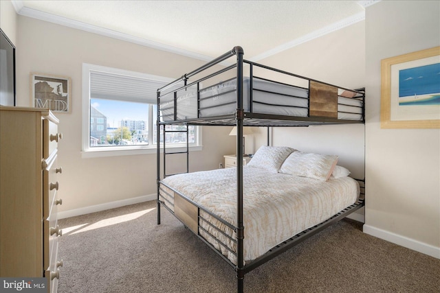 carpeted bedroom featuring ornamental molding