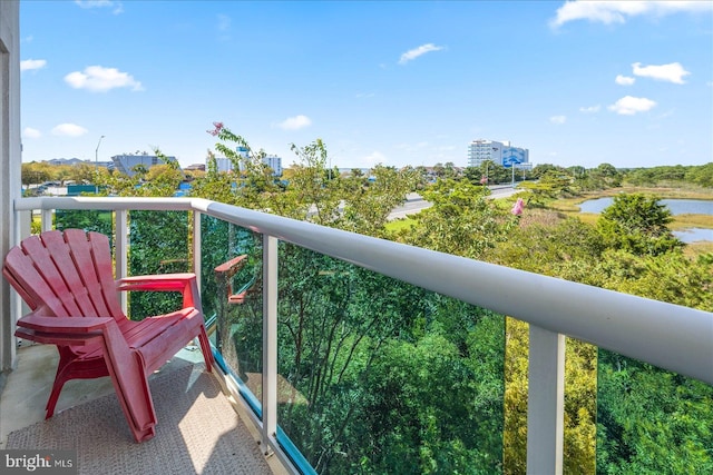 balcony featuring a water view