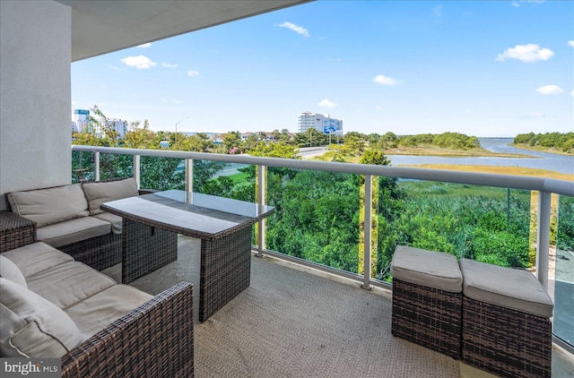 balcony featuring a water view