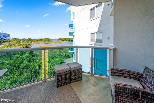 balcony featuring a water view