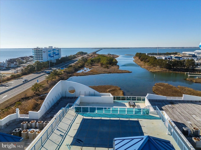 birds eye view of property with a water view