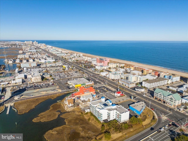 aerial view with a water view and a view of the beach