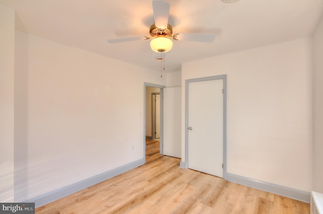 unfurnished room featuring ceiling fan and light hardwood / wood-style flooring