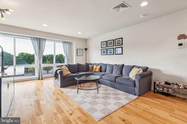 living room with light hardwood / wood-style floors