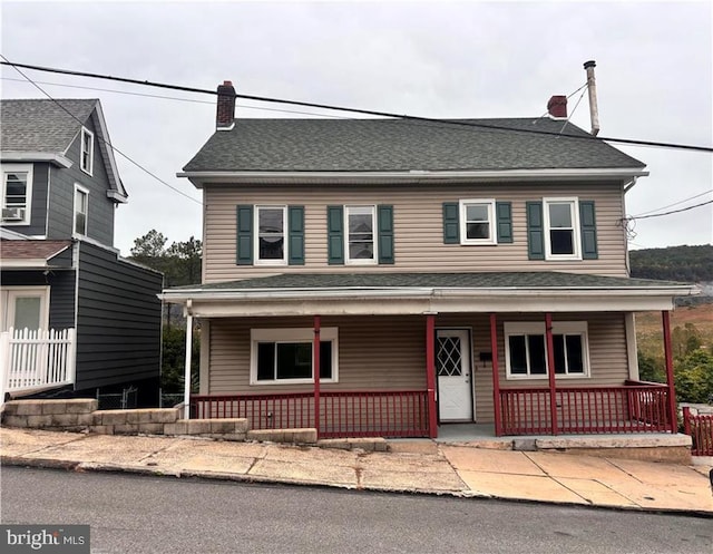 view of front property featuring covered porch