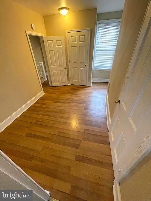 corridor featuring hardwood / wood-style flooring