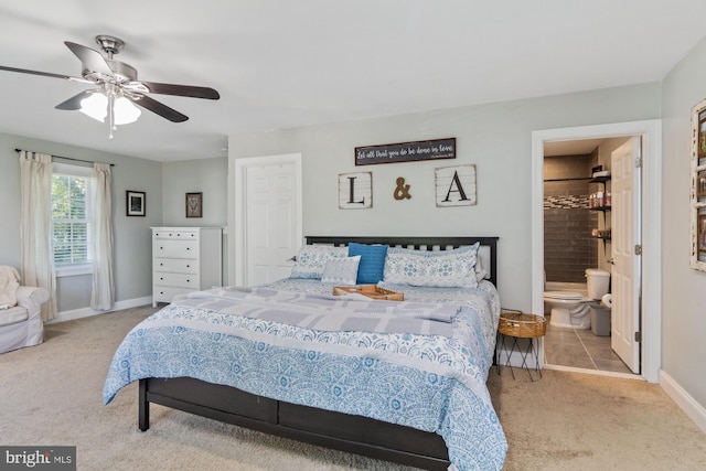 carpeted bedroom featuring connected bathroom and ceiling fan