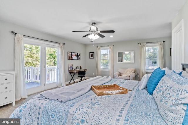 bedroom with ceiling fan, light carpet, and access to outside