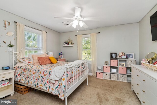 carpeted bedroom with ceiling fan