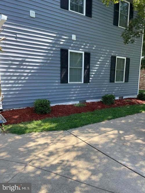 view of side of home with a patio area