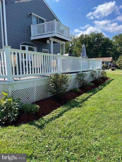 exterior space with a balcony and a deck