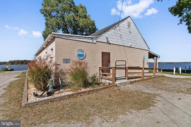 view of front facade with a water view