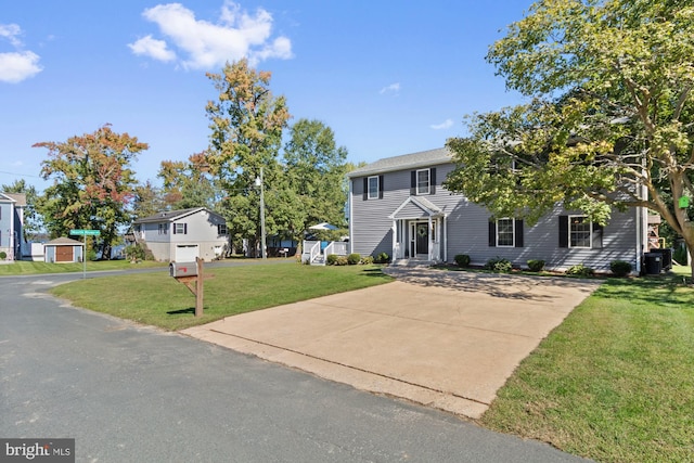 view of front facade with a garage and a front lawn