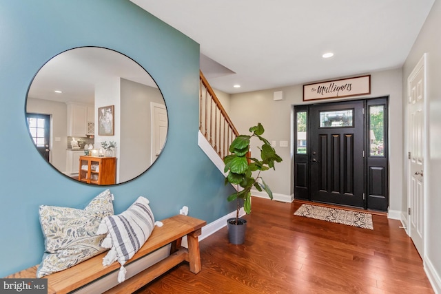 entrance foyer with dark hardwood / wood-style floors