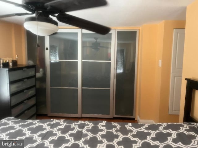 unfurnished bedroom with a closet and ceiling fan