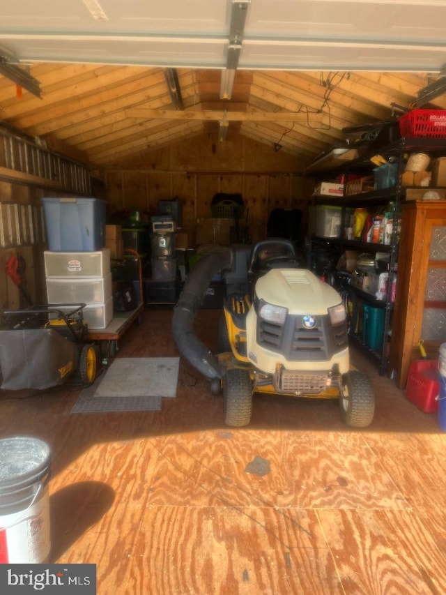 garage featuring wood walls