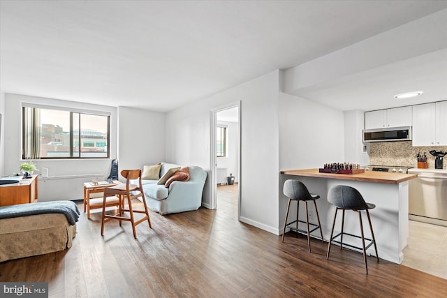 living room with dark hardwood / wood-style floors