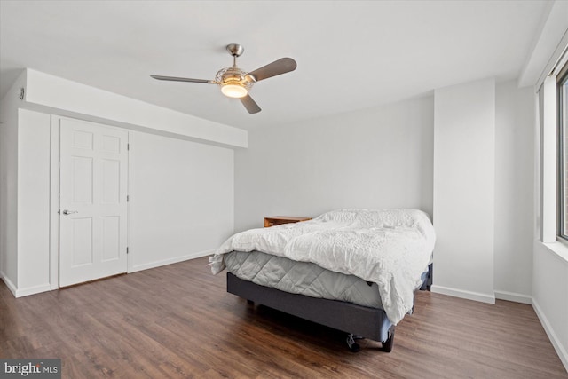 bedroom featuring dark wood-type flooring and ceiling fan